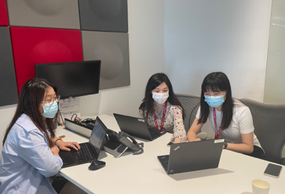 Employees meeting safely while wearing masks